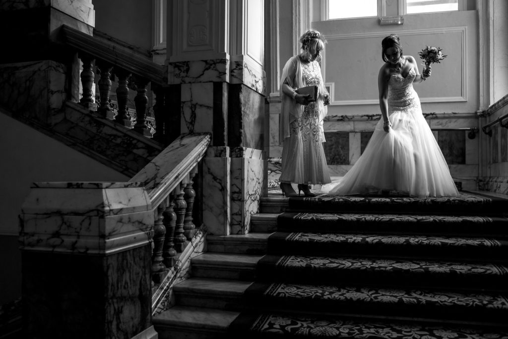 Bride on the stairs of Brighton Grand Hotel