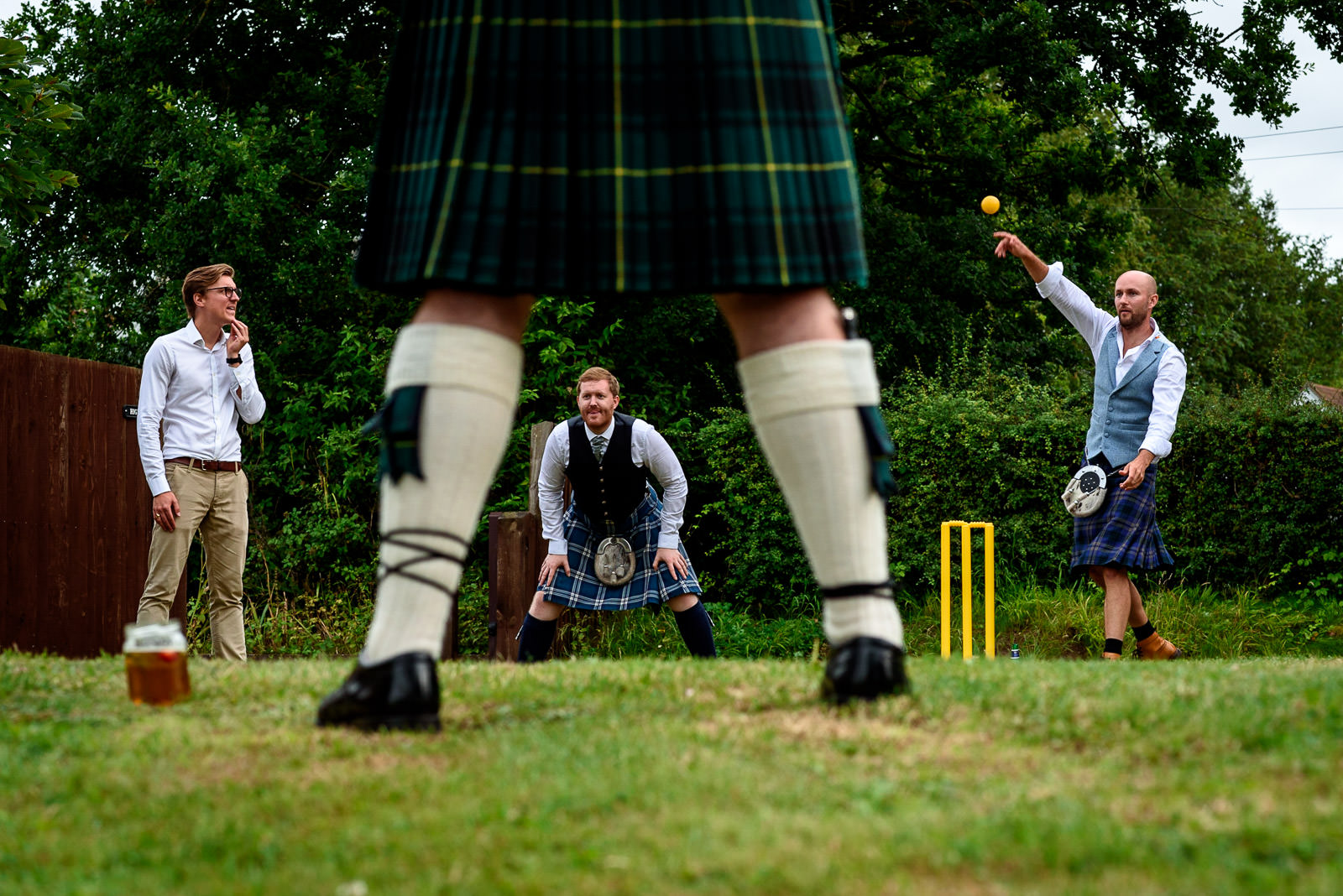 guests playing cricket at festival wedding in Brighton