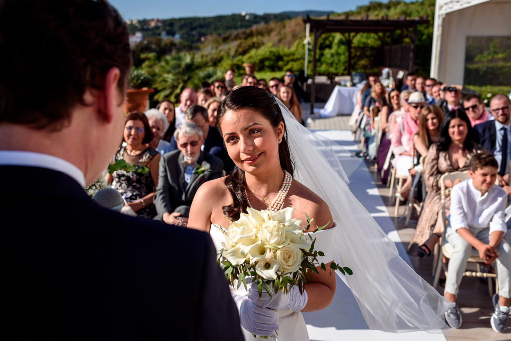 bride laughing during her wedding ceremony in Castiglioncello