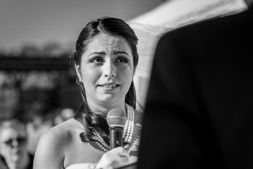 bride crying during wedding ceremony at Villa Parisi in Castiglioncello