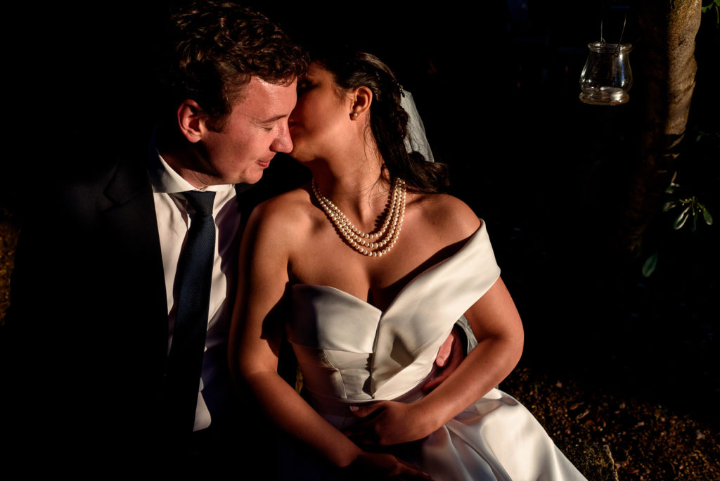 couple taking wedding photos at sunset at Villa Parisi in Castiglioncello