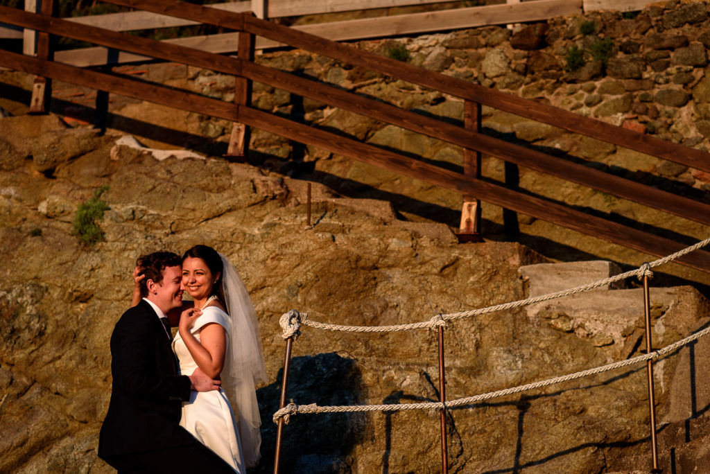 couple taking wedding photos at sunset at Villa Parisi in Castiglioncello