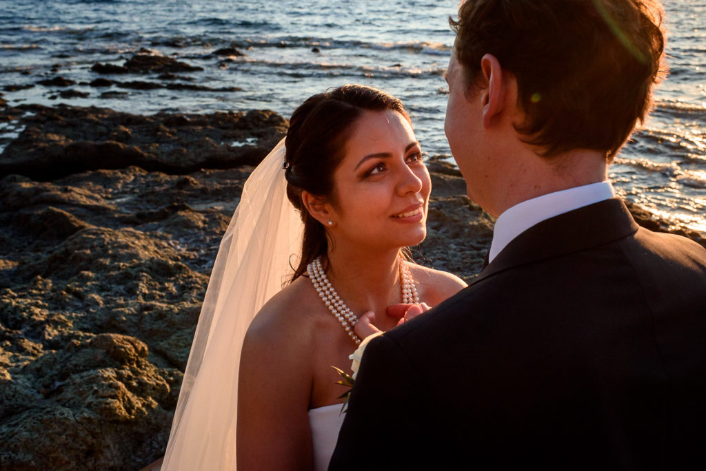 couple taking wedding photos at sunset in Castiglioncello